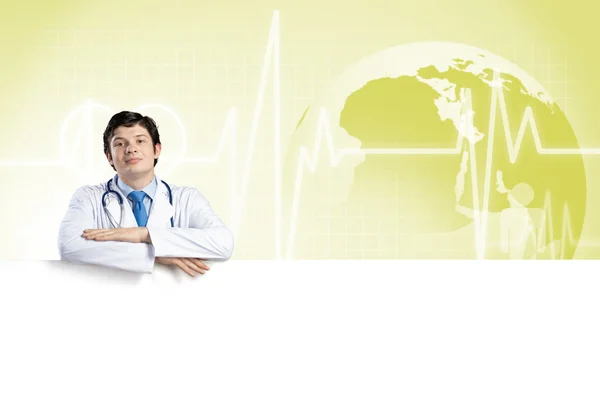 Doctor holding blank banner — Stock Photo, Image