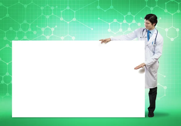 Doctor con banner en blanco — Foto de Stock