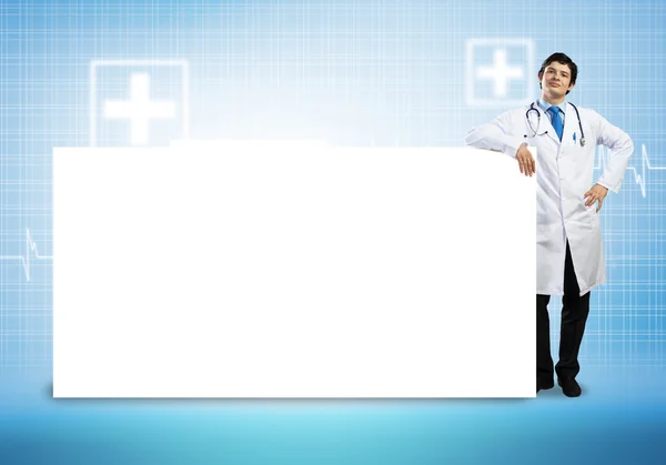 Doctor con banner en blanco — Foto de Stock