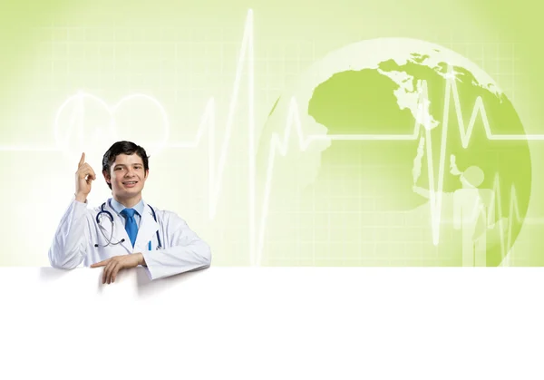 Doctor holding blank banner — Stock Photo, Image