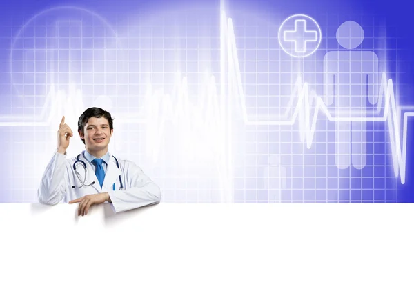 Doctor holding blank banner — Stock Photo, Image