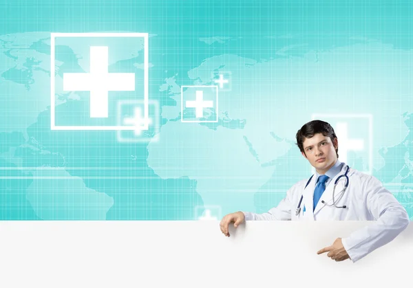 Doctor holding blank banner — Stock Photo, Image