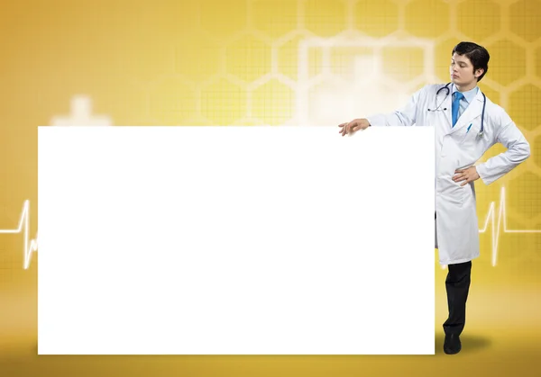 Doctor with blank banner — Stock Photo, Image