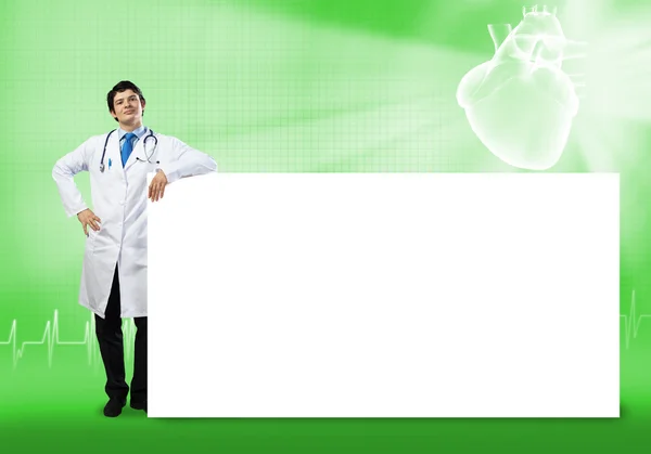 Medico con banner in bianco — Foto Stock