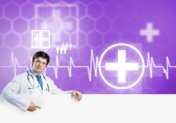 Doctor holding blank banner — Stock Photo, Image