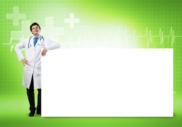 Doctor con banner en blanco —  Fotos de Stock