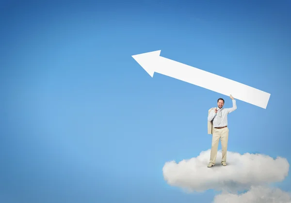 Businessman on cloud holding arrow — Stock Photo, Image