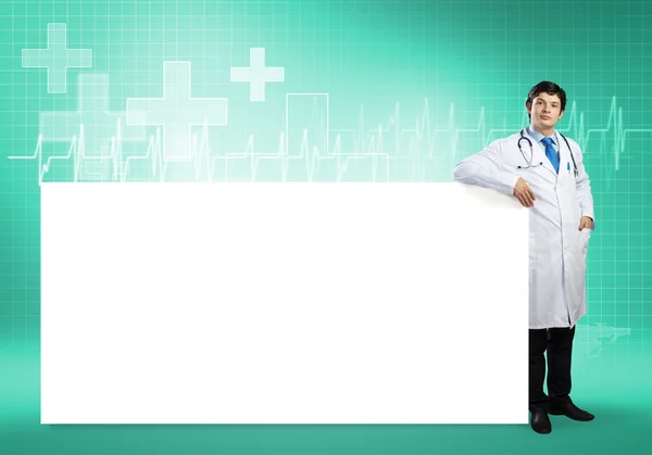 Doctor with blank banner — Stock Photo, Image