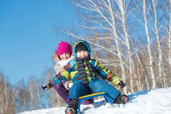 Kids riding sled — Stock Photo, Image