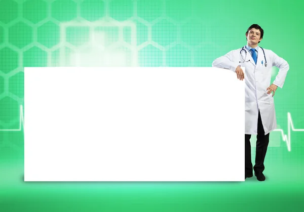 Doctor con banner en blanco — Foto de Stock