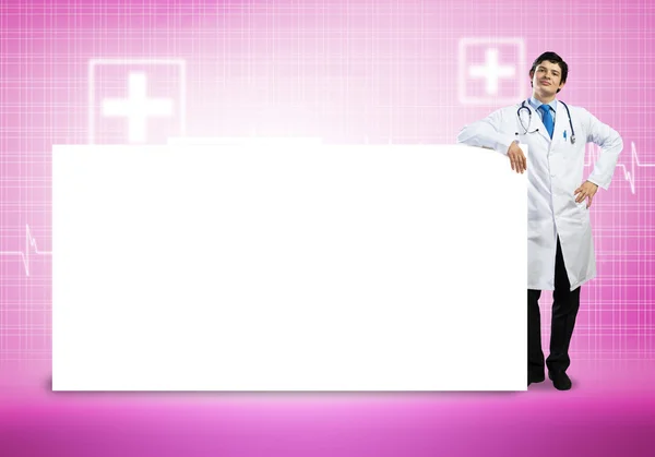 Doctor con banner en blanco —  Fotos de Stock