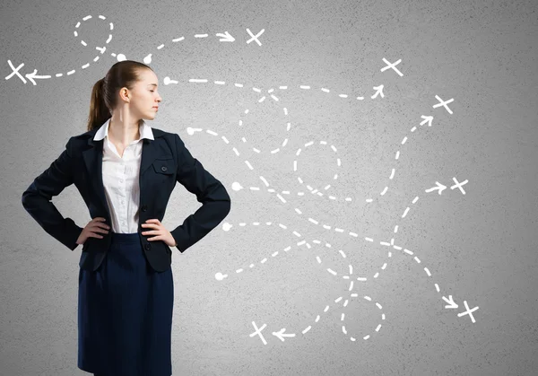 Businesswoman and drawn arrows — Stock Photo, Image