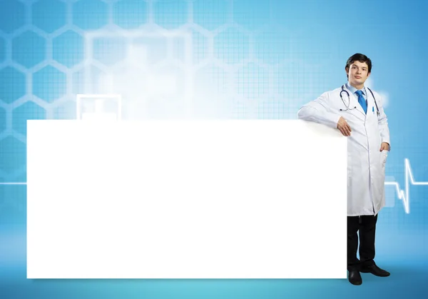 Doctor with blank banner — Stock Photo, Image