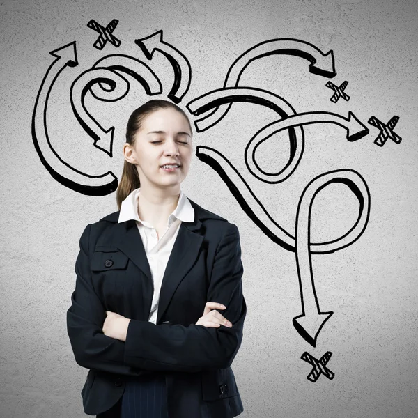 Businesswoman and drawn arrows — Stock Photo, Image