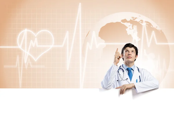 Doctor holding blank banner — Stock Photo, Image