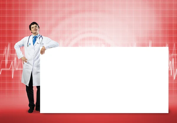 Doctor with blank banner — Stock Photo, Image