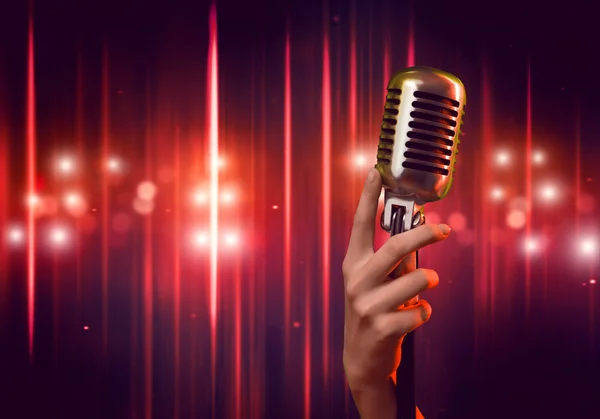 Female hand with microphone — Stock Photo, Image