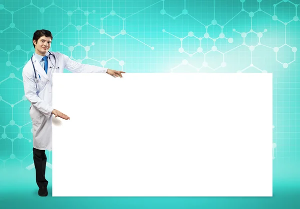 Doctor con banner en blanco —  Fotos de Stock