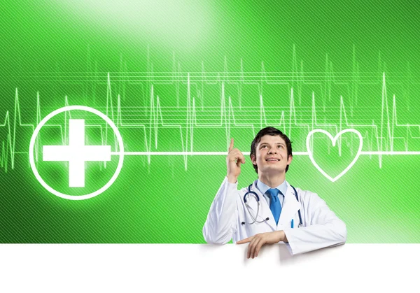 Doctor holding blank banner — Stock Photo, Image