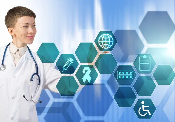 Female doctor touching icon — Stock Photo, Image