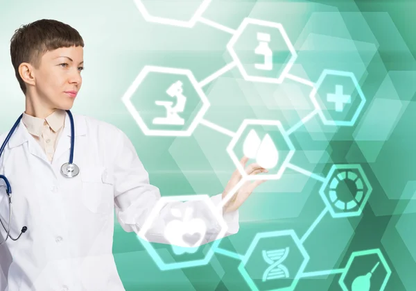 Female doctor touching icon — Stock Photo, Image