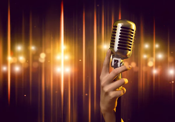 Female hand with microphone — Stock Photo, Image