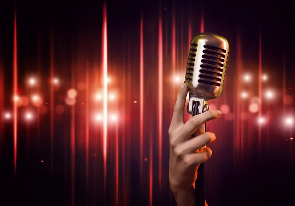 Female hand with microphone — Stock Photo, Image