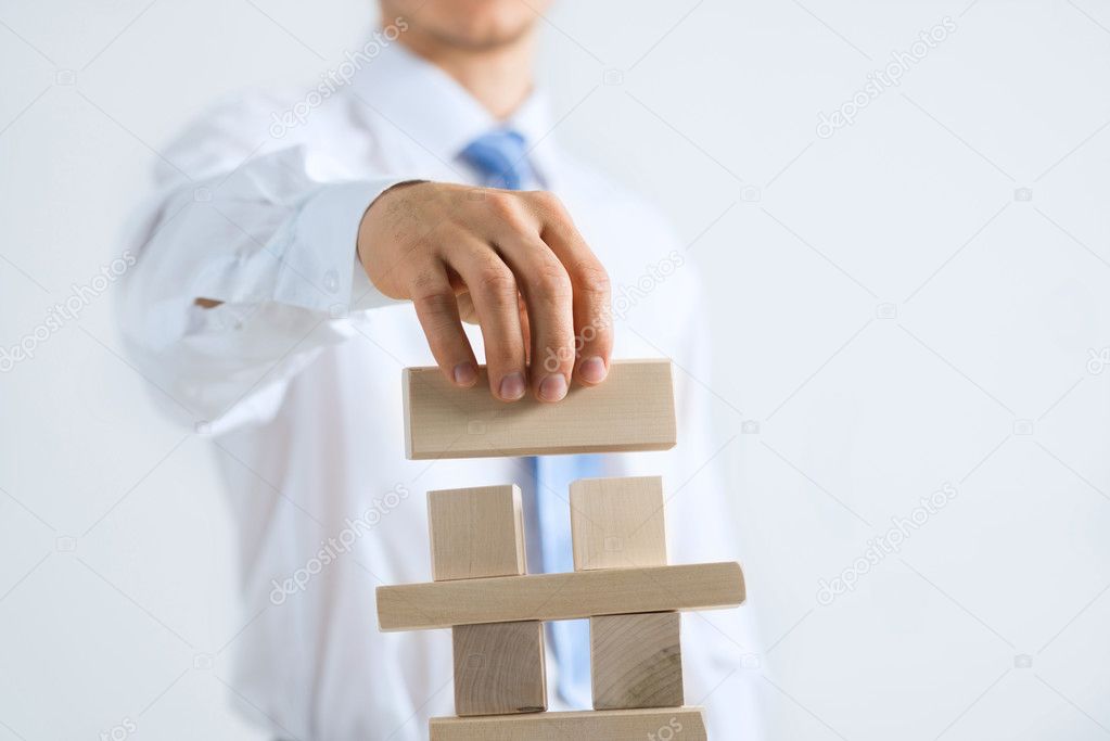 businessman building tower