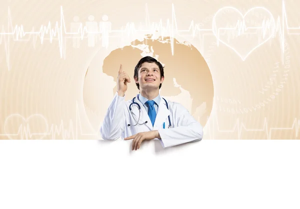 Doctor holding blank banner — Stock Photo, Image