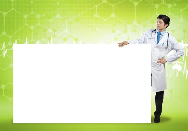 Doctor with blank banner — Stock Photo, Image
