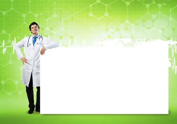 Doctor con banner en blanco — Foto de Stock