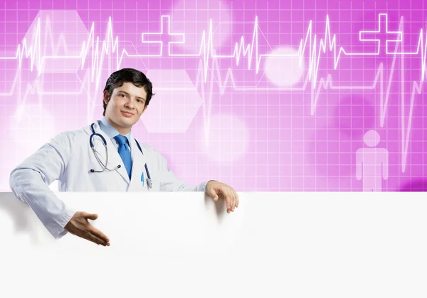 Doctor holding blank banner — Stock Photo, Image