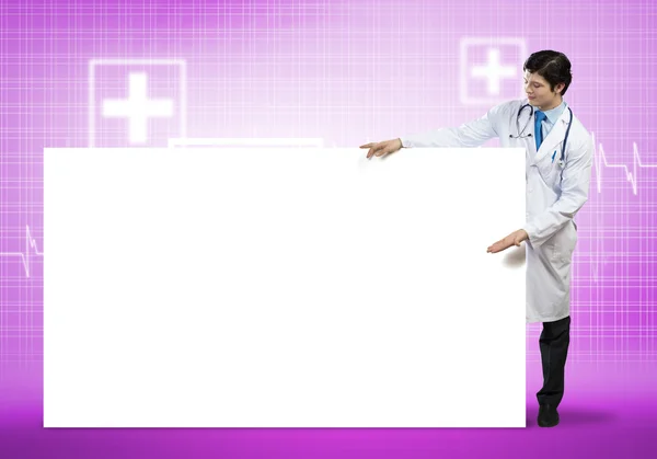 Doctor with blank banner — Stock Photo, Image