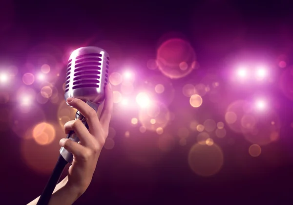 Female hand with microphone — Stock Photo, Image