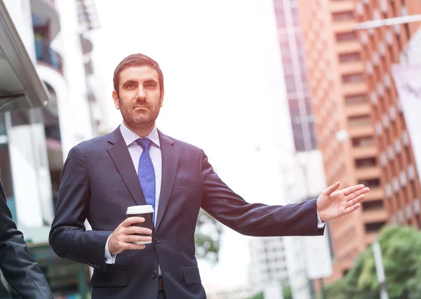 Businessman stopping car — Stock Photo, Image