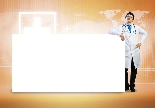 Doutor com banner em branco — Fotografia de Stock