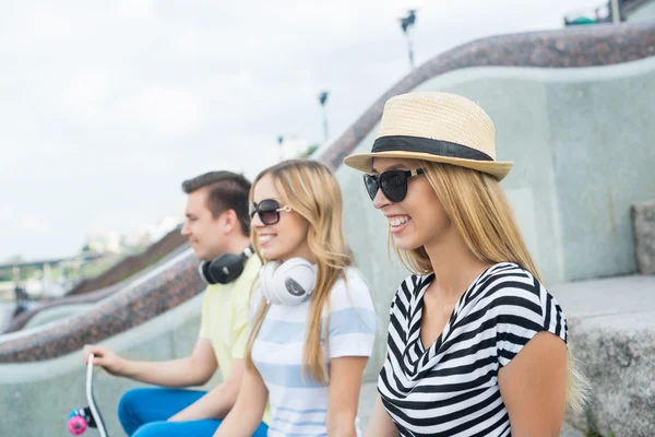 Young people sitting on staircase — Stock Photo, Image