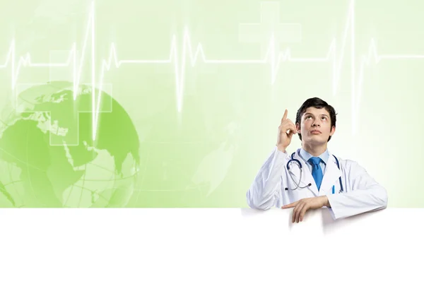 Doctor holding blank banner — Stock Photo, Image