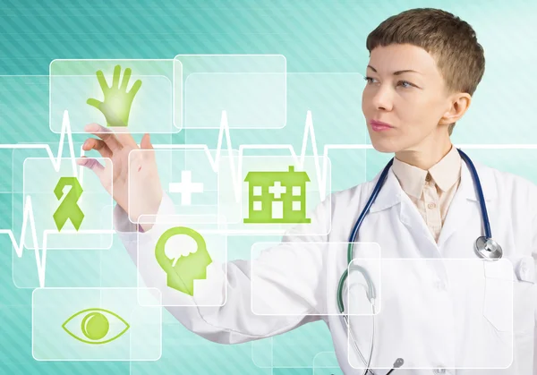 Female doctor touching icon — Stock Photo, Image