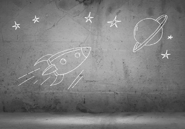 Drawn on wall flying rocket — Stock Photo, Image