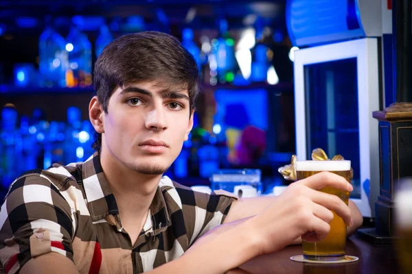 Young man at bar — Stock Photo, Image