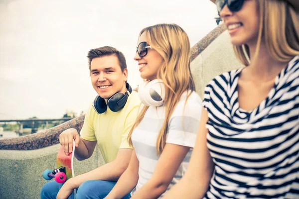 Young people sitting on staircase — Stock Photo, Image