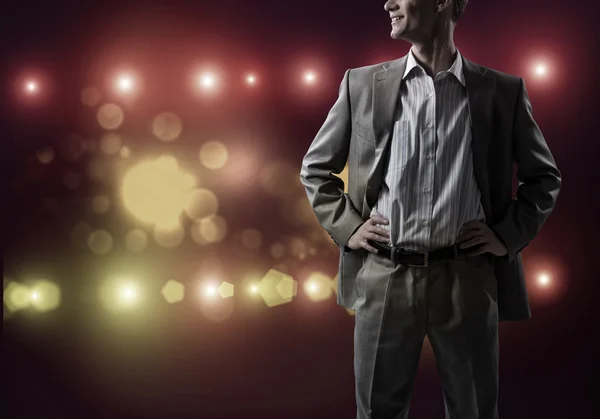 Confident businessman in bokeh lights — Stock Photo, Image