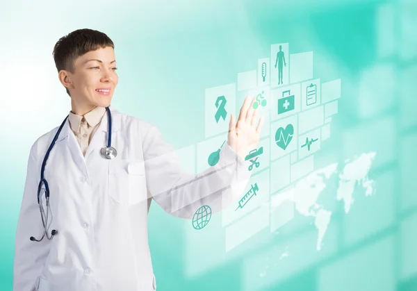 Female doctor touching icon — Stock Photo, Image