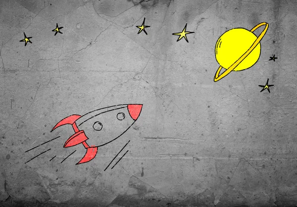 Drawn on wall flying rocket — Stock Photo, Image