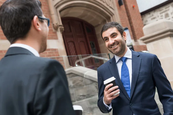 businessmen taking coffee break