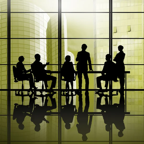 Businesspeople  sitting round table — Stock Photo, Image