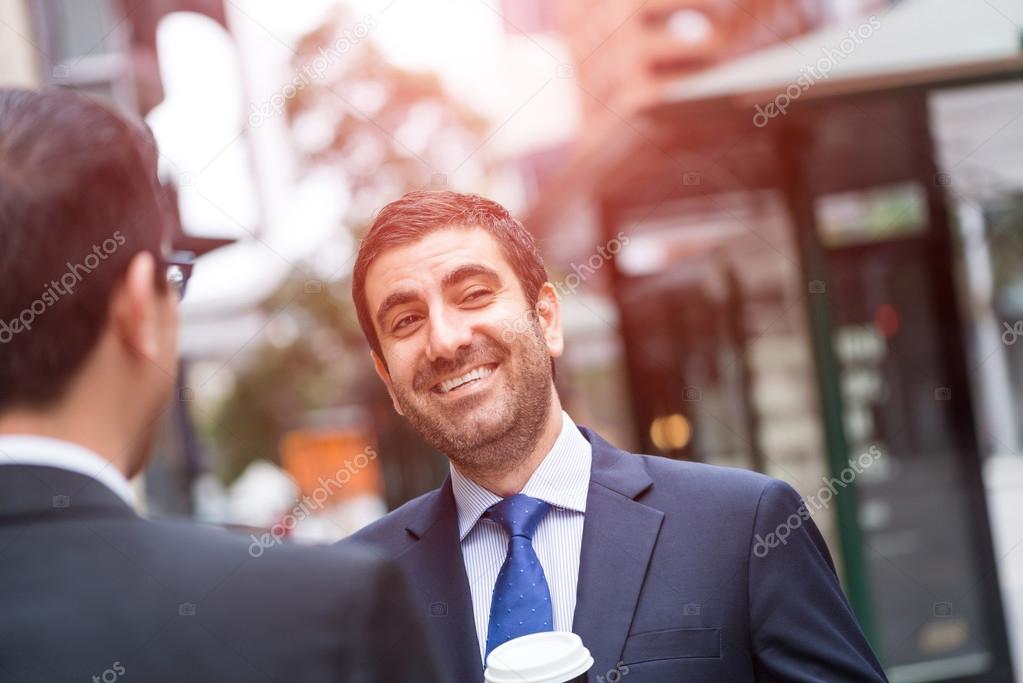 businessmen taking coffee break