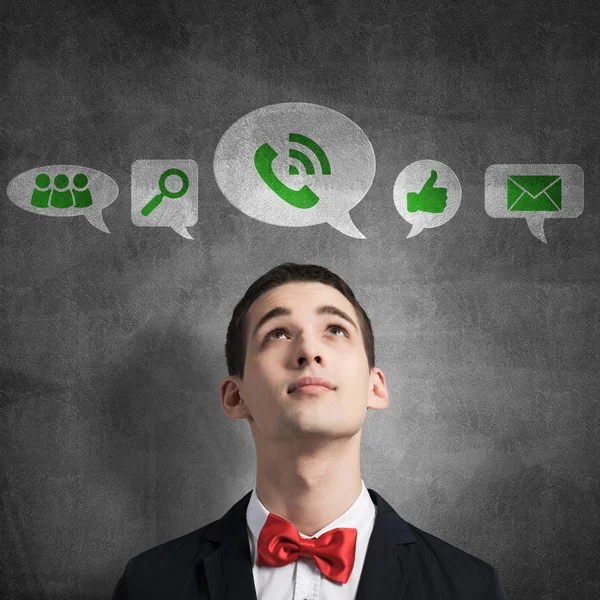 Man in red bowtie and collection of icons — Stock Photo, Image