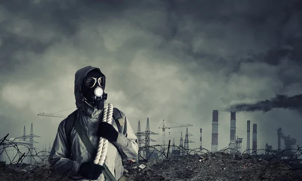 Man survivor in gas mask — Stock Photo, Image